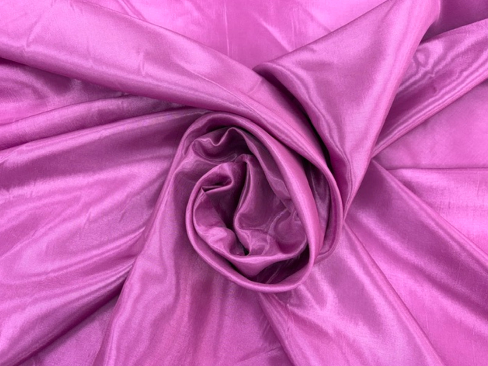 Purple and pink taffeta fabric by Cheapfabrics, shown in a close-up image highlighting its smooth, shiny texture and vibrant color.