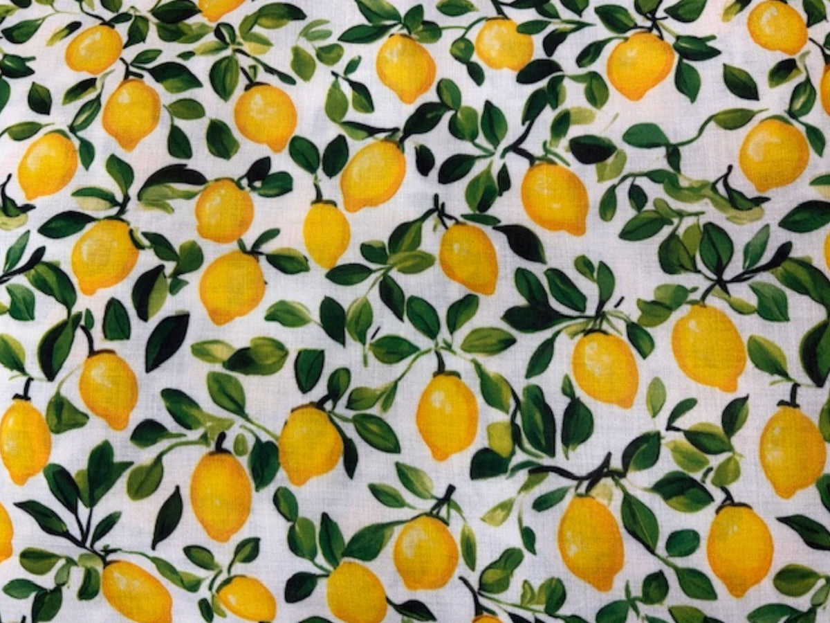 Yellow and green Mediterranean lemon print linen fabric from Cheap Fabrics, showing a vibrant citrus-themed textile with detailed lemon illustrations.