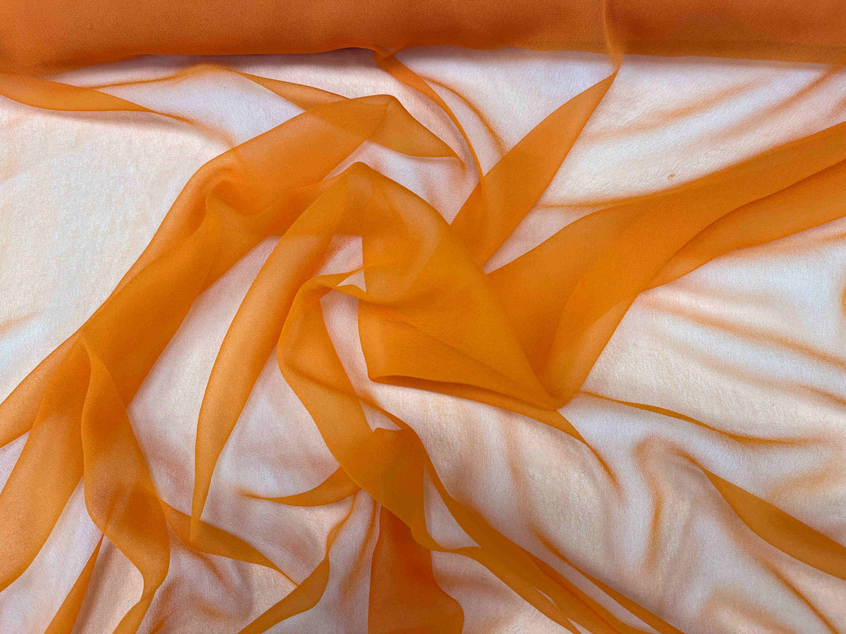 Plain orange chiffon fabric from Cheap Fabrics, showcasing lightweight, smooth, and sheer textile ideal for sewing or craft projects.