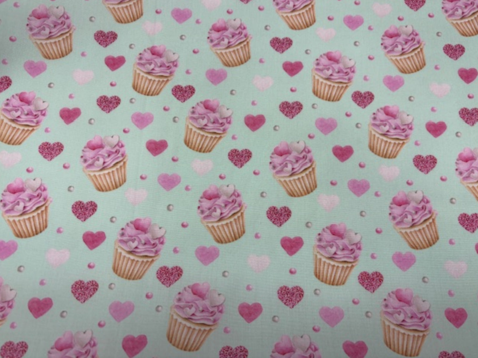 Poly/cotton fabric with afternoon tea and cupcake print in white, perfect for quilting or sewing projects by Cheap Fabrics.
