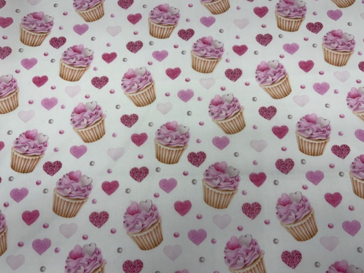 Poly/cotton fabric with afternoon tea and cupcake print in white, perfect for quilting or sewing projects by Cheap Fabrics.