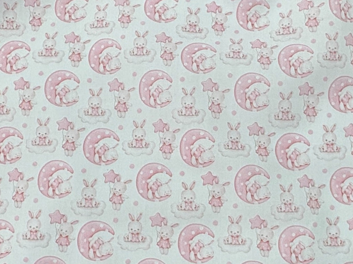 Polycotton printed fabric featuring cute bunny illustrations by Cheap Fabrics, ideal for crafting or sewing projects.
