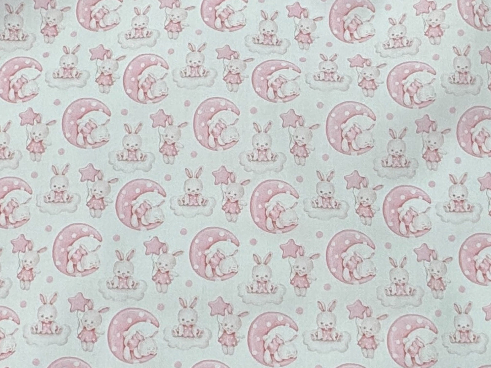 Polycotton printed fabric featuring cute bunny illustrations by Cheap Fabrics, ideal for crafting or sewing projects.