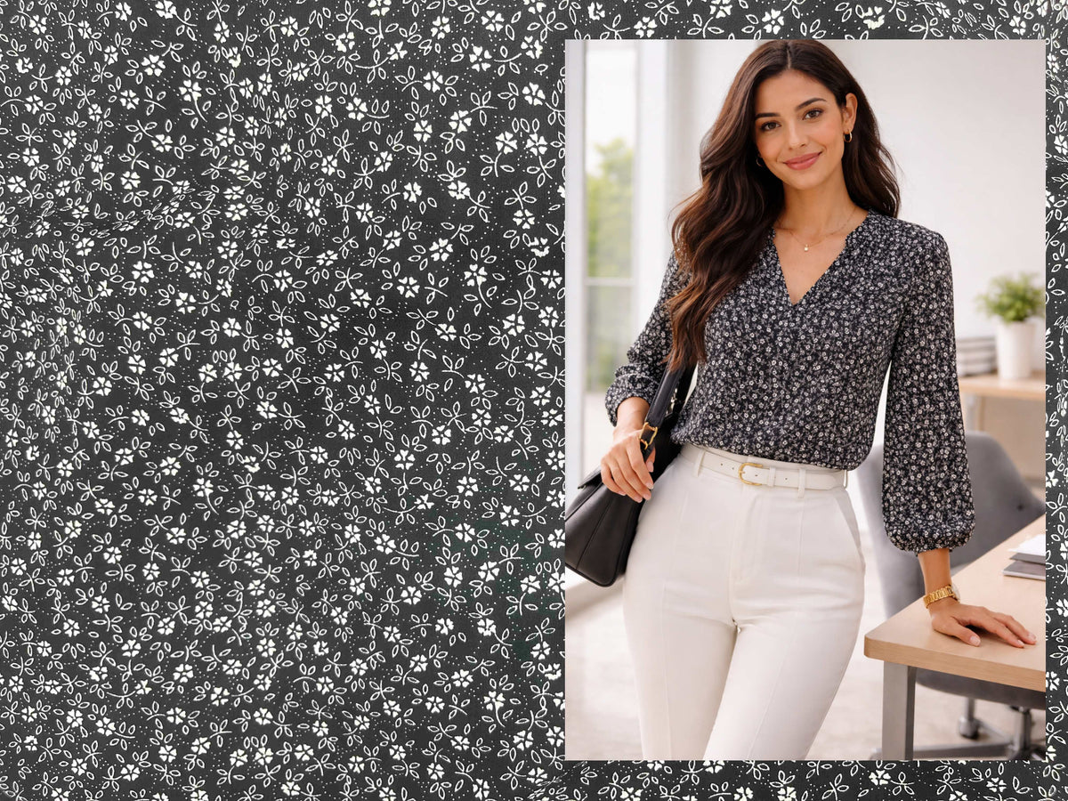 Black Ditsy Floral printed crepe fabric by Cheap Fabrics, featuring a delicate floral pattern on smooth crepe material.