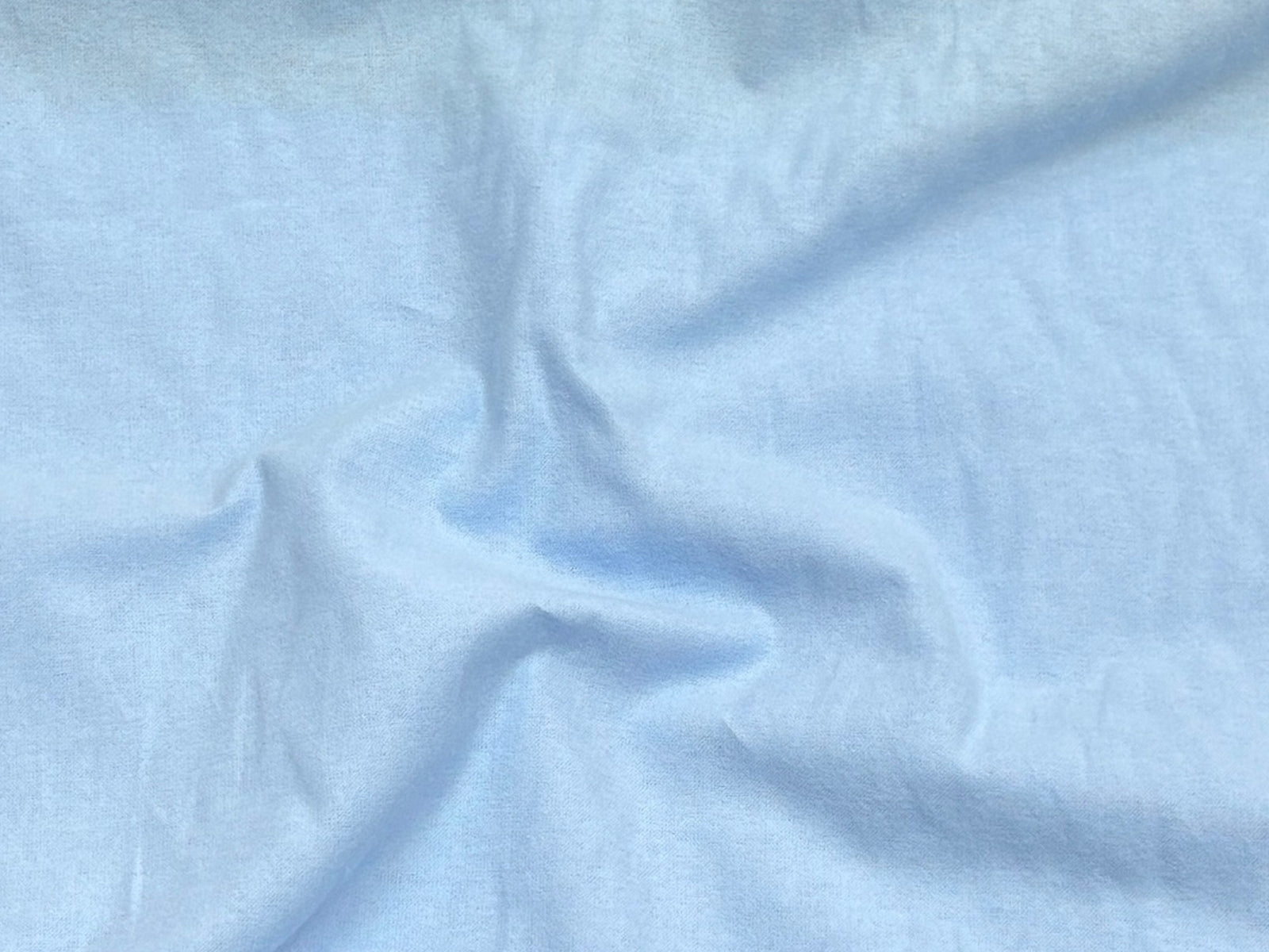 Light yellow Wynciette brushed cotton fabric from Cheap Fabrics, showcasing soft, textured material ideal for quilting and apparel.