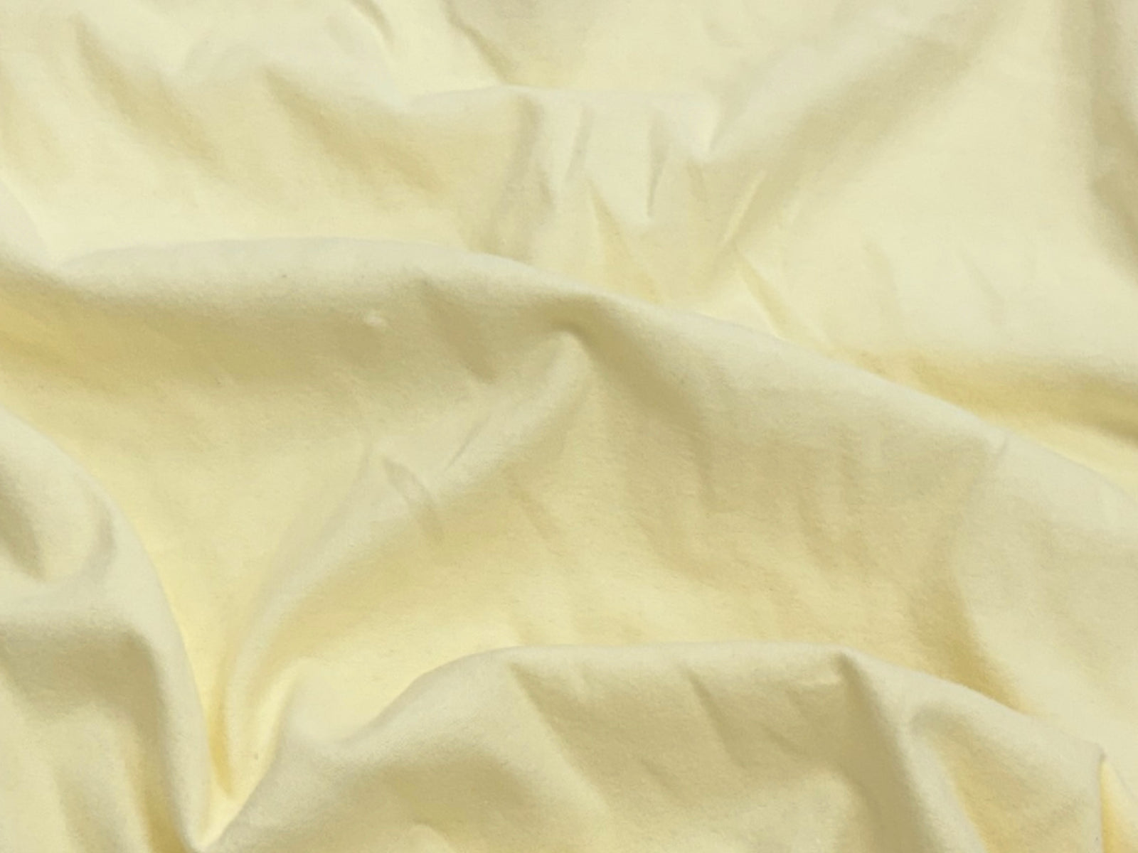 Light yellow Wynciette brushed cotton fabric from Cheap Fabrics, showcasing soft, textured material ideal for quilting and apparel.