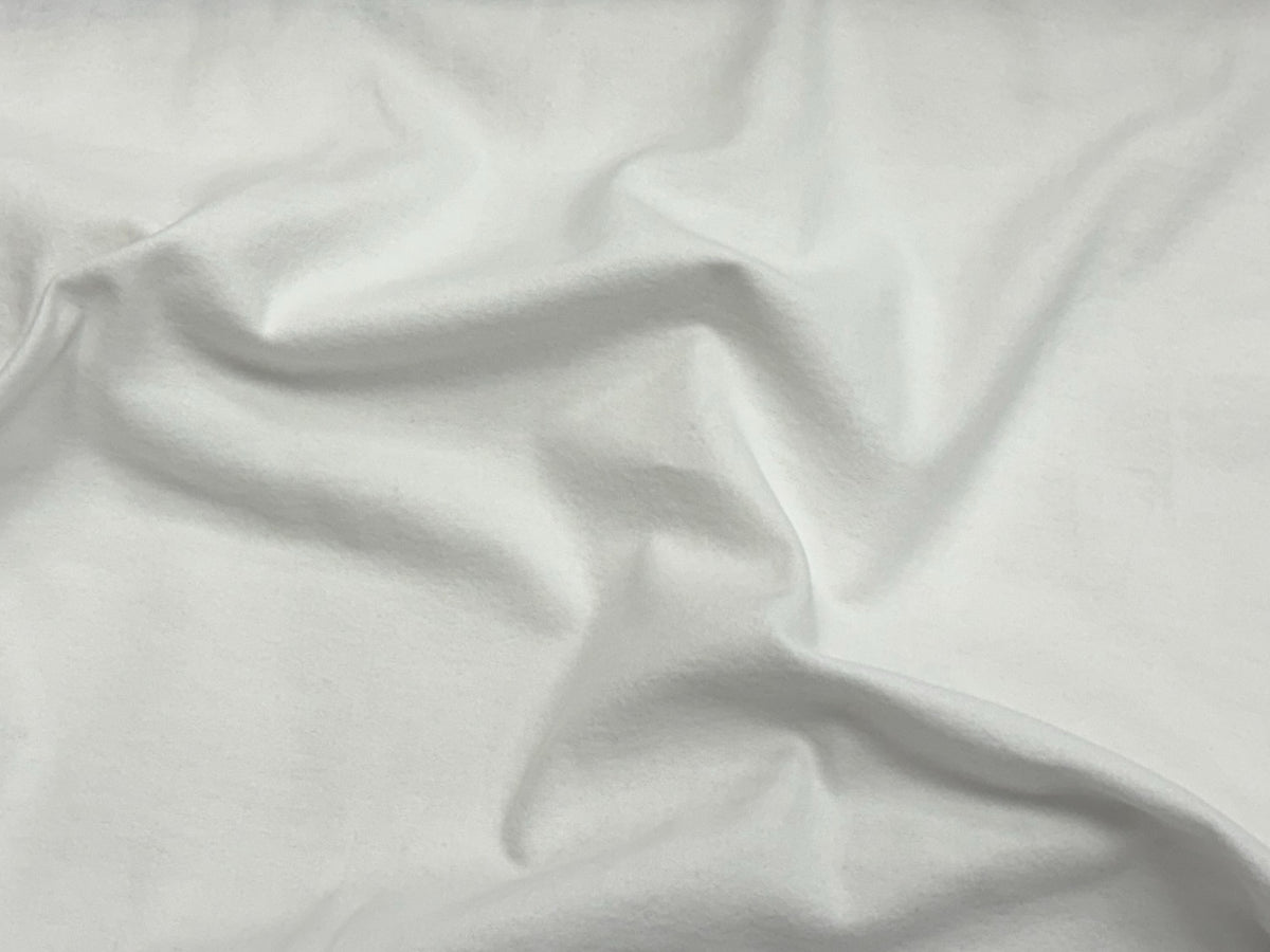 White Wynciette brushed cotton fabric, soft and lightweight textile from Cheap Fabrics, shown in a close-up image.