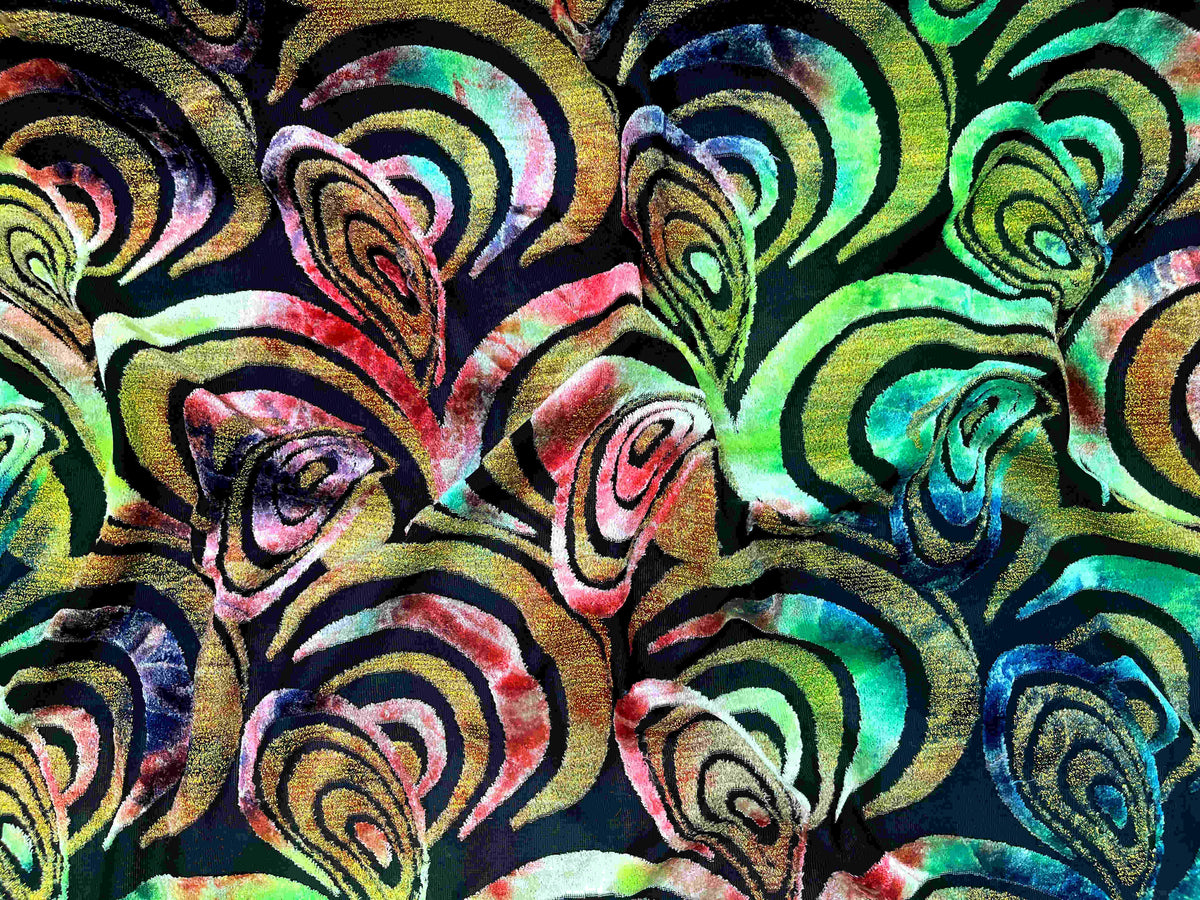 Bright lime and coral burnout velvet knit fabric with spiral retro pattern from Cheapfabrics, showcasing soft, textured velvet material.