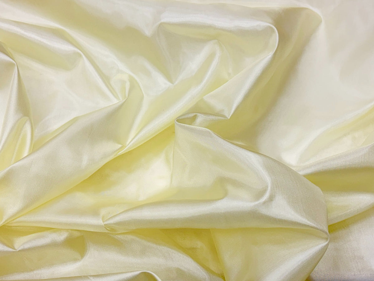 Cream-colored lining fabric from Cheap Fabrics, showcasing smooth and lightweight lining material for clothing or upholstery.