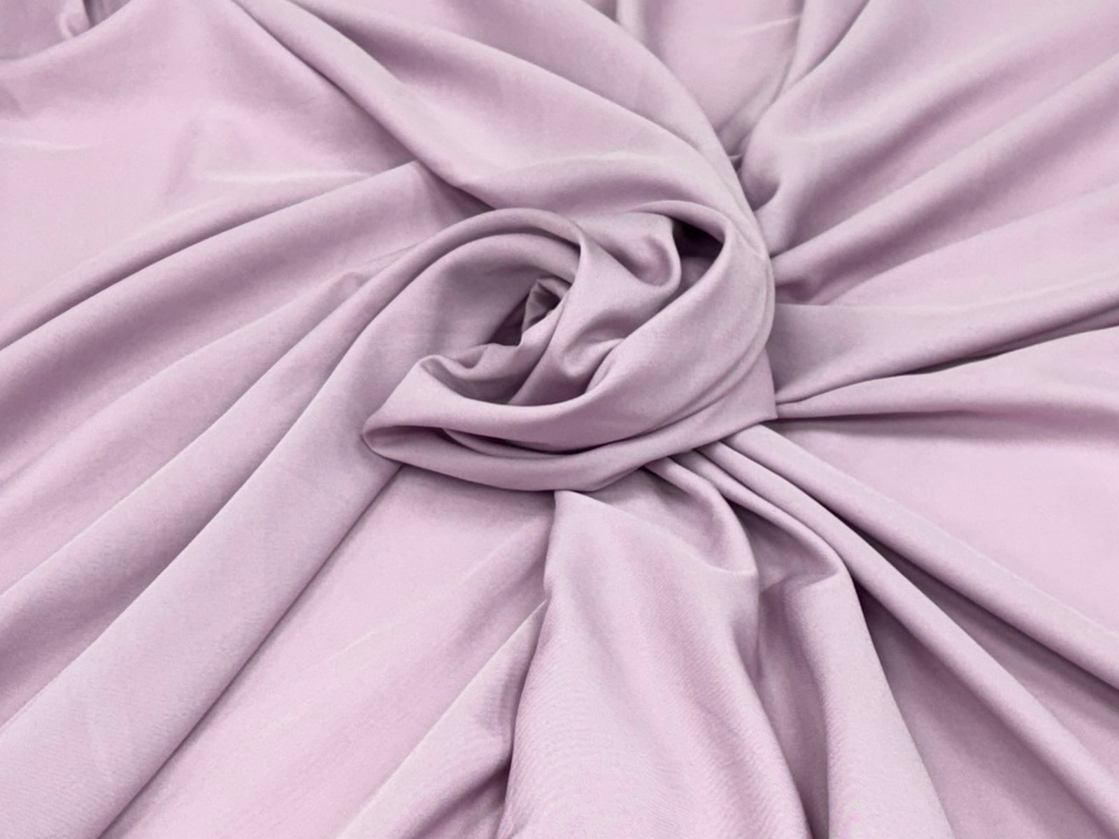 Dusty pink plain matte crepe lining fabric from Cheap Fabrics, showcasing smooth, lightweight lining material for sewing projects.