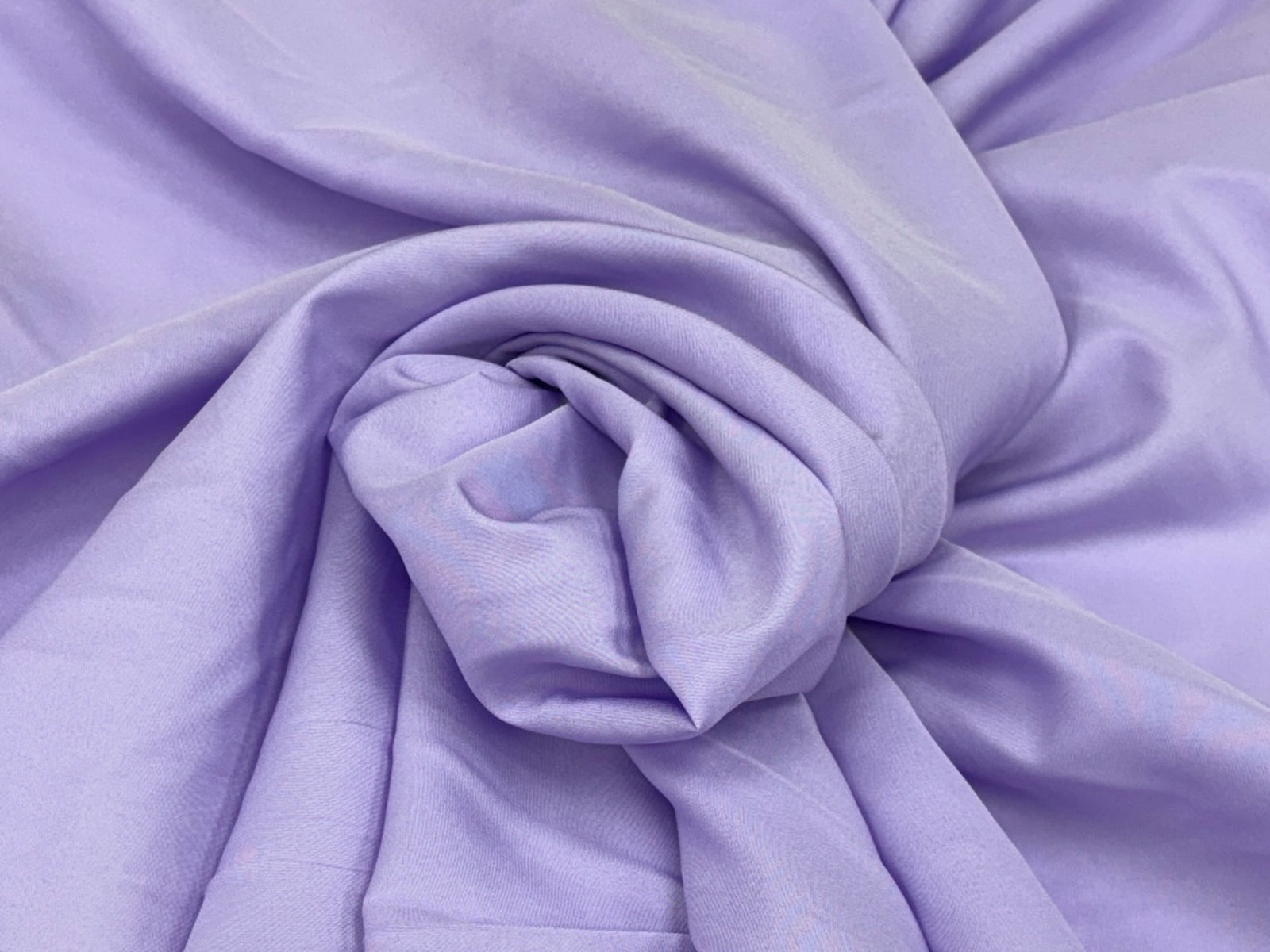 Dusty pink plain matte crepe lining fabric from Cheap Fabrics, showcasing smooth, lightweight lining material for sewing projects.