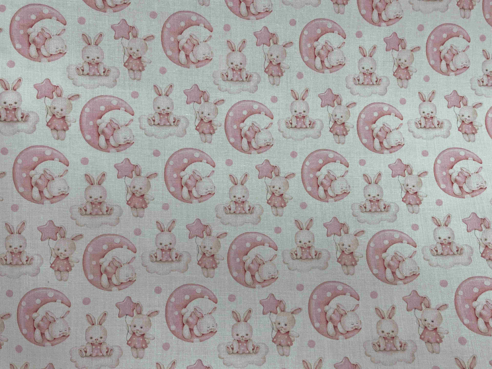 Polycotton printed fabric featuring cute bunny illustrations by Cheap Fabrics, ideal for crafting or sewing projects.
