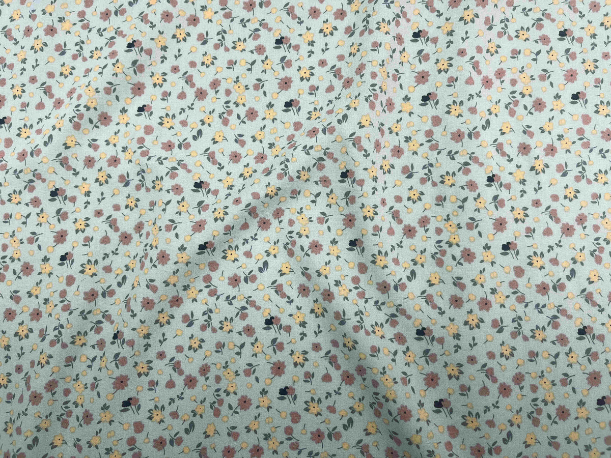Deluxe Printed Viscose Fabric featuring Daisy Me pattern, displayed in a close-up image showcasing the fabric's lightweight, colorful design.