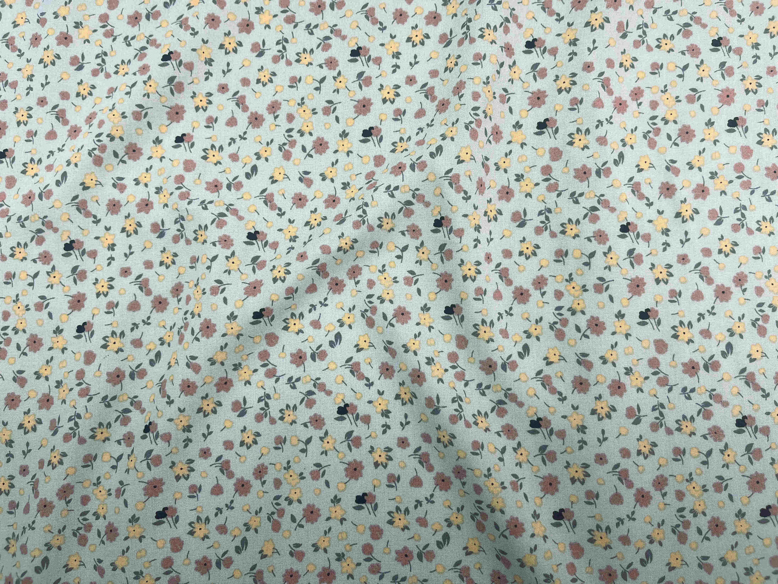 Deluxe Printed Viscose Fabric featuring Daisy Me pattern, displayed in a close-up image showcasing the fabric's lightweight, colorful design.