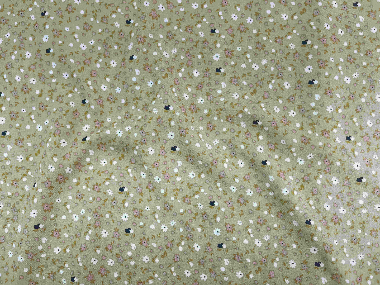 Deluxe Printed Viscose Fabric featuring Daisy Me pattern, displayed in a close-up image showcasing the fabric's lightweight, colorful design.