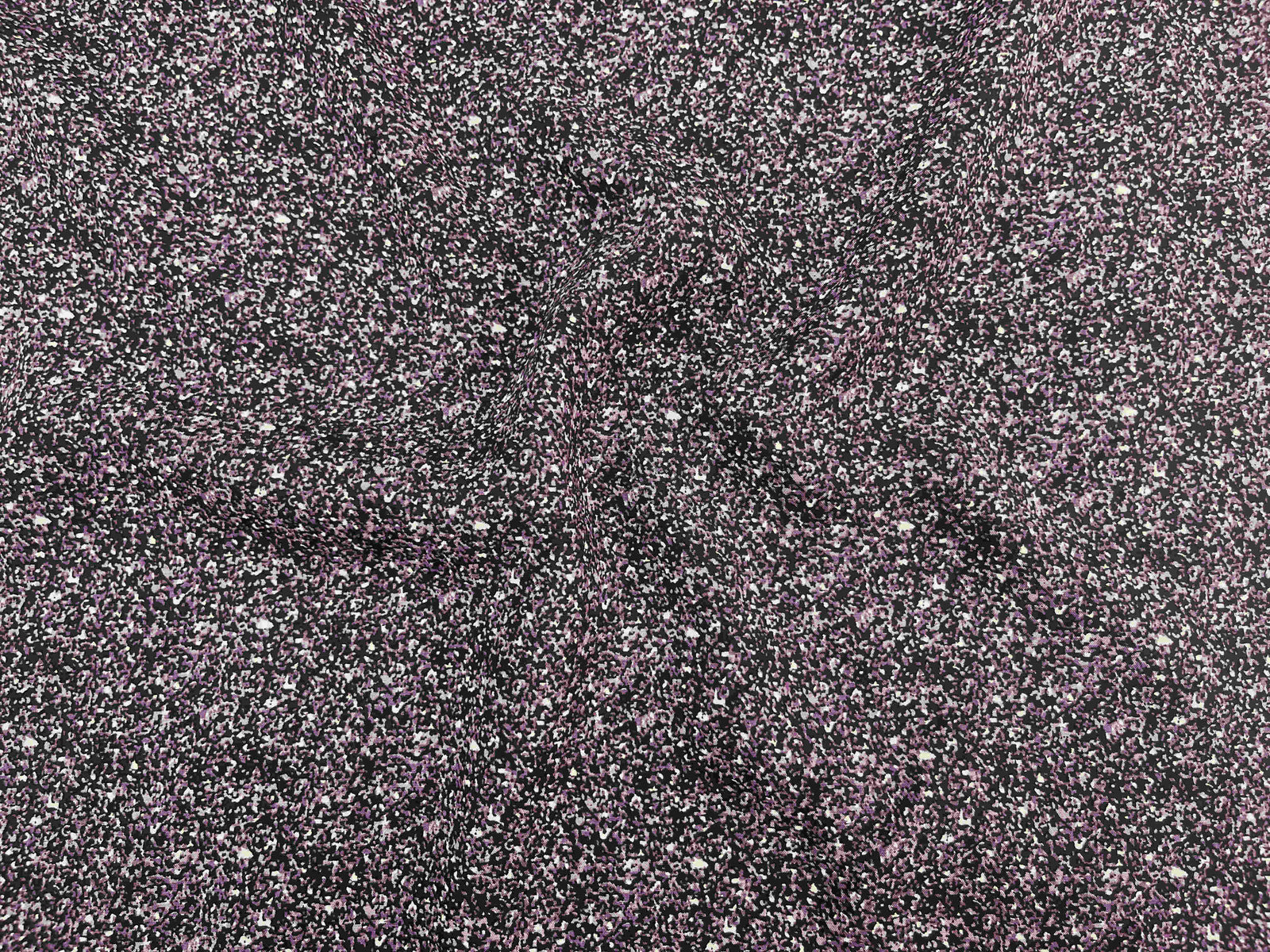 Deluxe printed viscose fabric in granite with violet patterns, showcasing soft, lightweight textile by Cheap Fabrics.