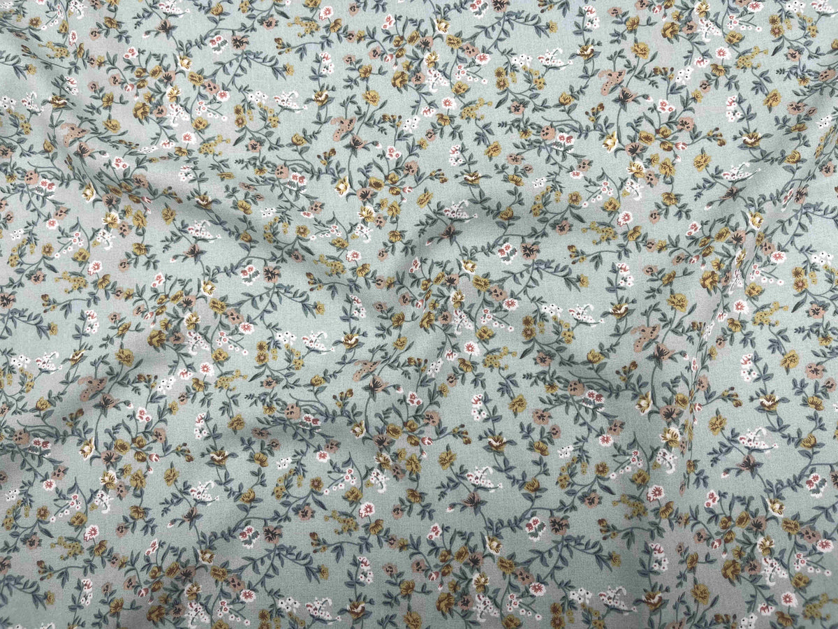 Deluxe printed viscose fabric with a micro floral pattern in duck egg color, by Cheap Fabrics.