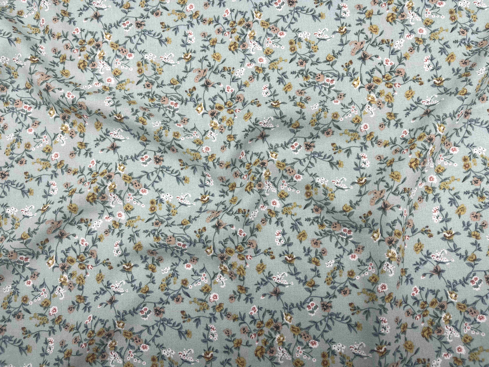 Beige Deluxe Printed Viscose Fabric with micro floral pattern by Cheap Fabrics, showcasing soft, lightweight textile with detailed floral design.