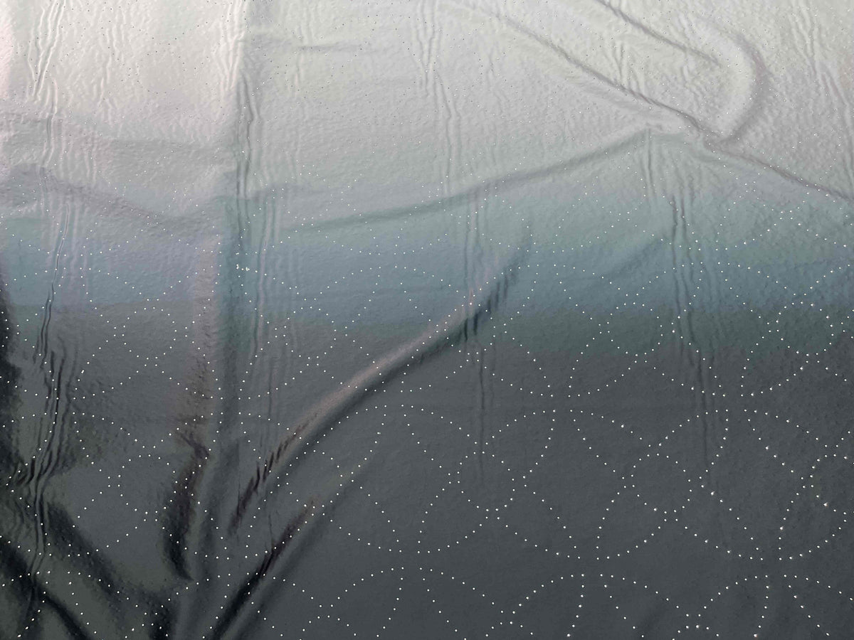 Black and silver Dew Drop Crystal Ombre Satin Fabric by Cheapfabrics, showing a smooth, shimmering satin material with crystal-inspired design.