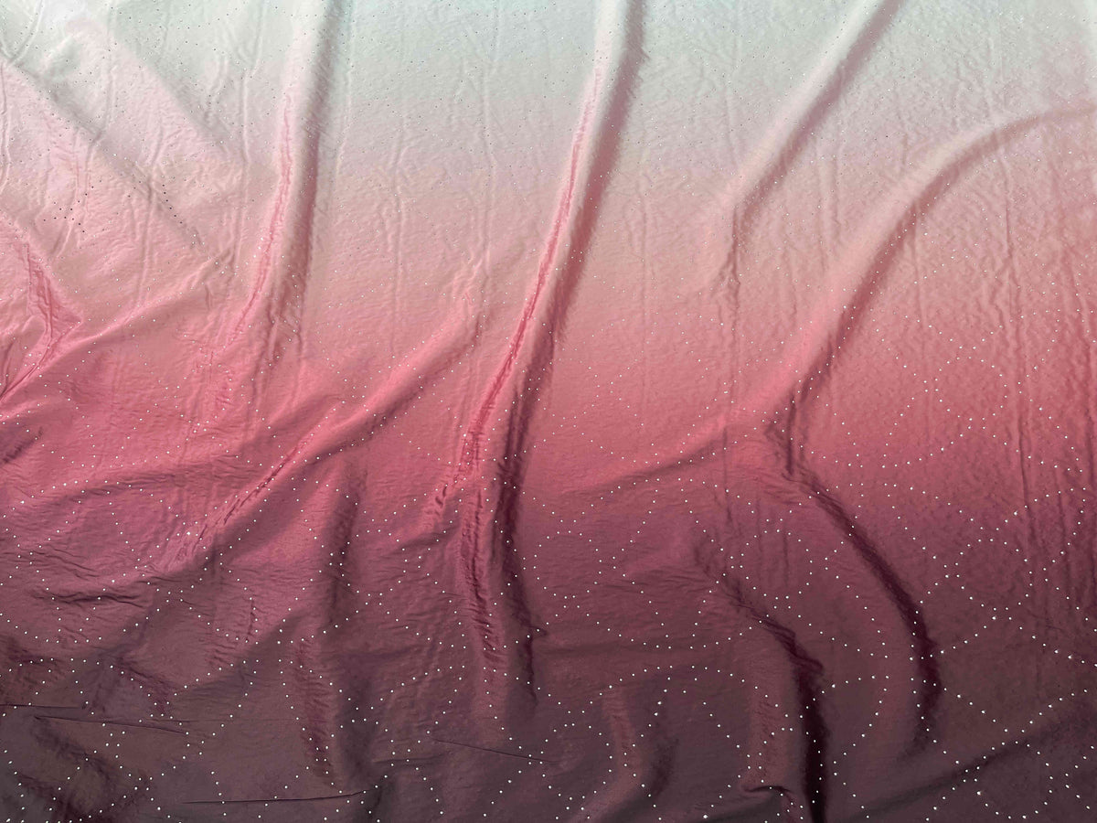 Wine pink Dew Drop Crystal Ombre Satin Fabric by Cheapfabrics, showing smooth satin surface with shimmering crystal accents.