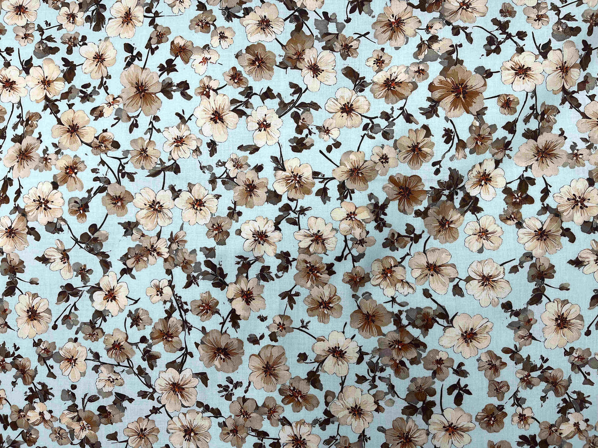 Digital printed cotton lawn fabric with a blossom aqua floral design, showcasing vibrant, detailed patterns on lightweight cotton.