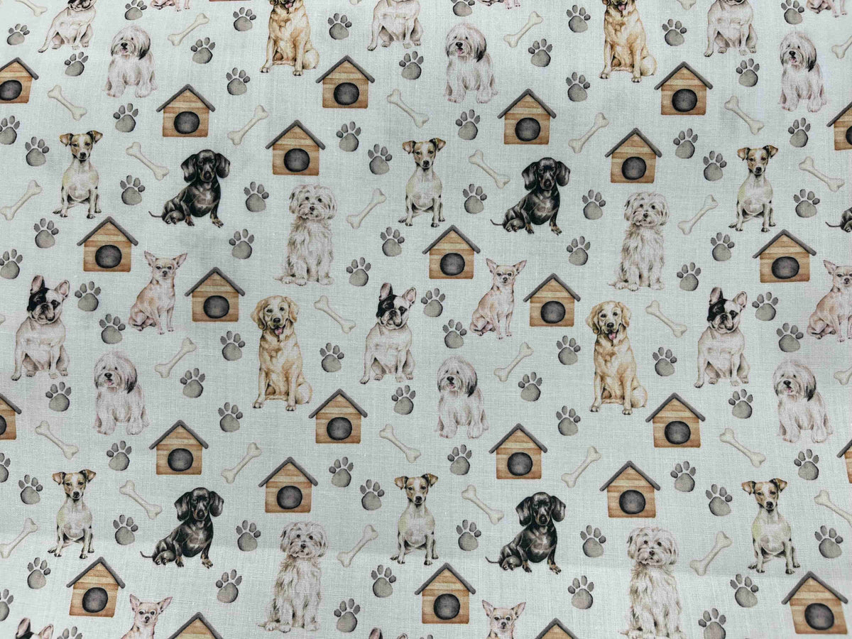 Polycotton printed fabric featuring dogs and bones pattern, ideal for sewing projects, by Cheap Fabrics.
