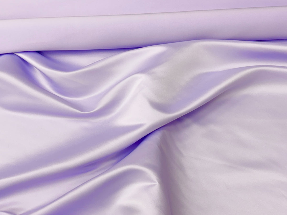 Lilac Duchess Satin fabric by Cheap Fabrics showing smooth, shiny satin material with elegant texture and rich color.