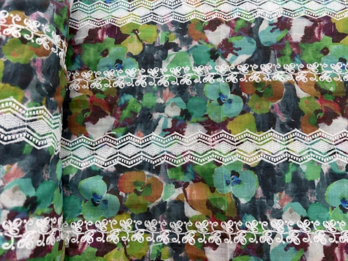 Embroidered cotton lawn fabric with multi-floral stripe pattern in green, ideal for dressmaking by Cheap Fabrics.