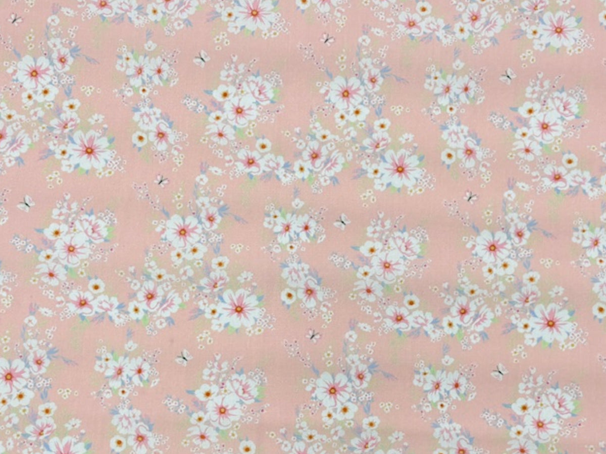Pink floral cluster polycotton fabric from Cheap Fabrics, ideal for sewing and craft projects.