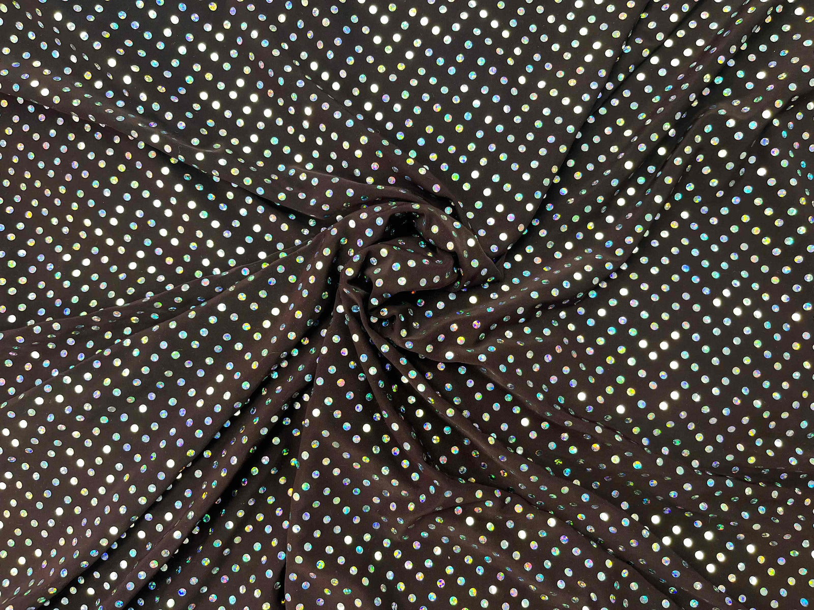 Hologram sequin jersey fabric in aubergine, showcasing shiny sequins on a soft, stretchy material.