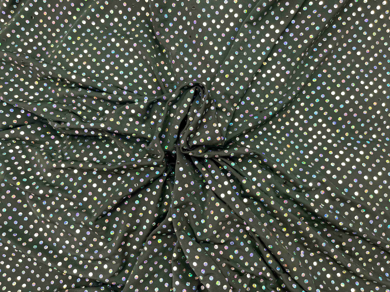 Hologram sequin jersey fabric in aubergine, showcasing shiny sequins on a soft, stretchy material.