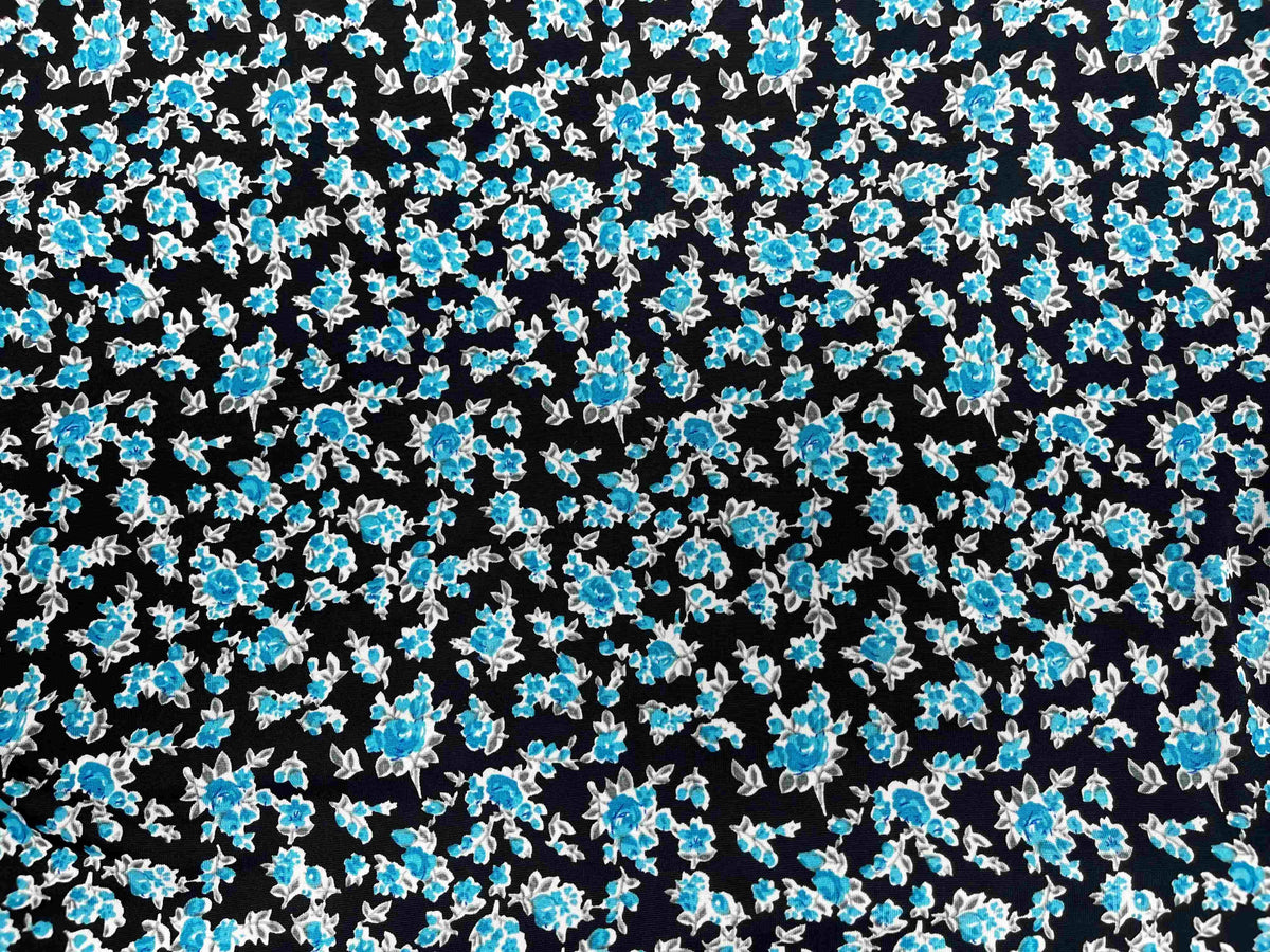 Black floral printed jersey fabric by Cheapfabrics featuring vibrant kingfisher bird and floral design on soft stretchy material.