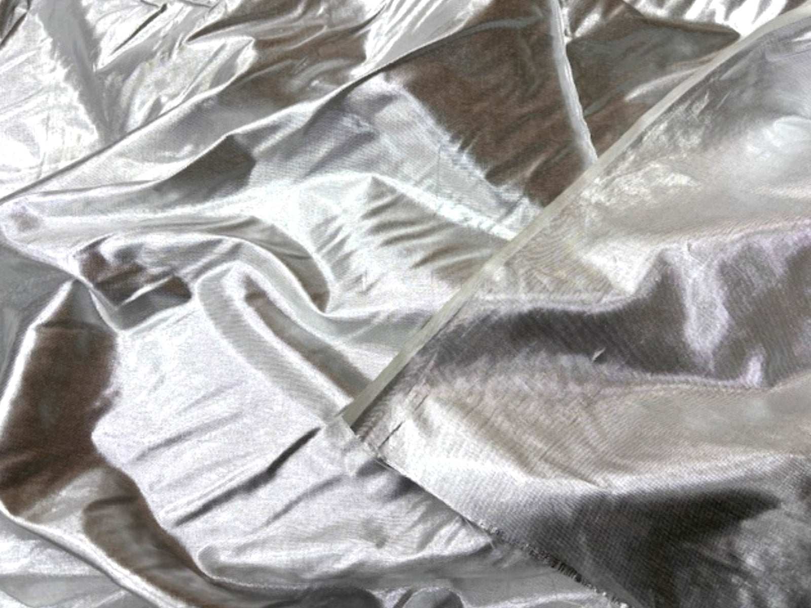 Gold lame fabric from Cheapfabrics, showcasing shiny, smooth, and reflective metallic material suitable for fashion and craft projects.