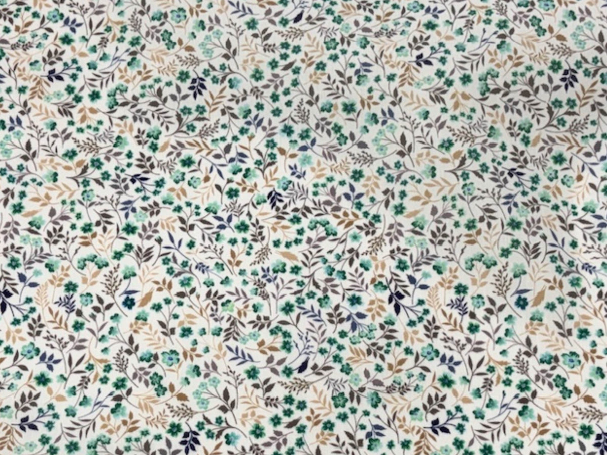 Jade green leafy ditsy floral polycotton fabric from Cheap Fabrics, showing a detailed pattern of small floral leaves on smooth material.
