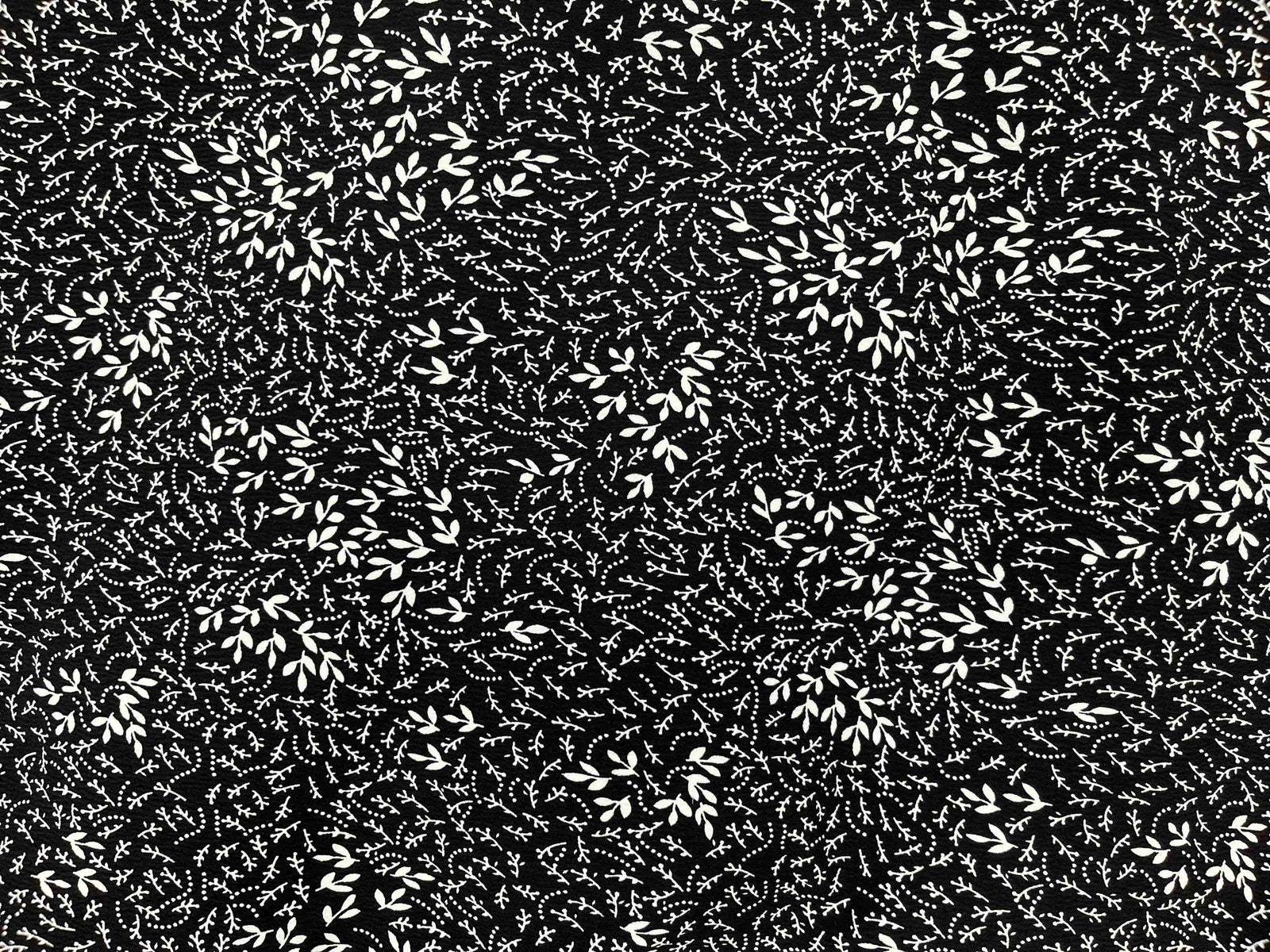 Black Leena crepe fabric from Cheap Fabrics, showing a smooth, lightweight crepe textile suitable for dresses and garments.