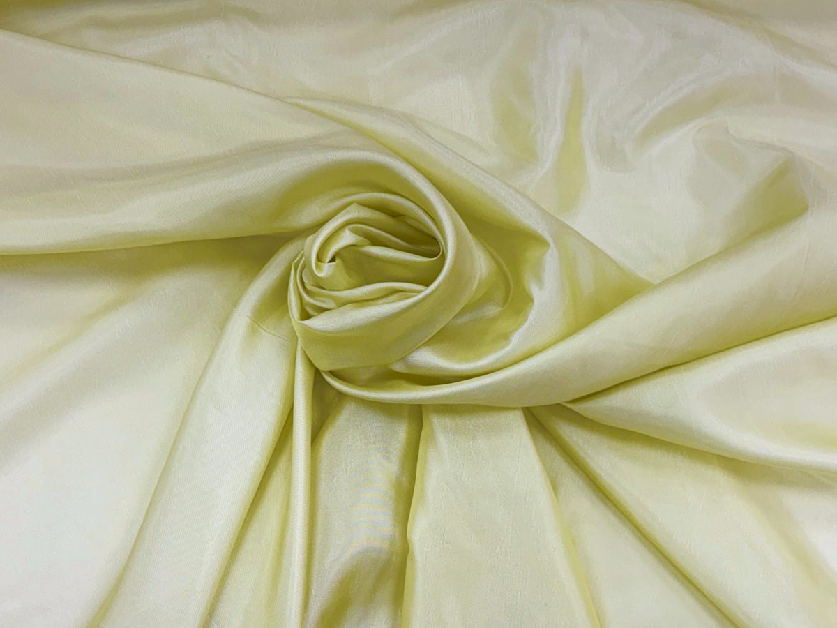 Lemon-colored taffeta fabric by Cheapfabrics, smooth and shiny textile material perfect for formal dresses and evening wear.