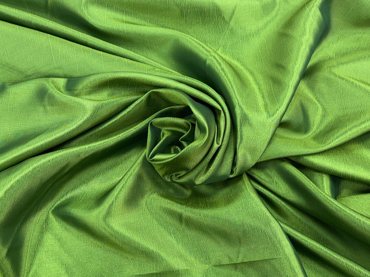 Bright lime green taffeta fabric from Cheapfabrics, showcasing smooth, shiny taffeta material with a crisp texture.