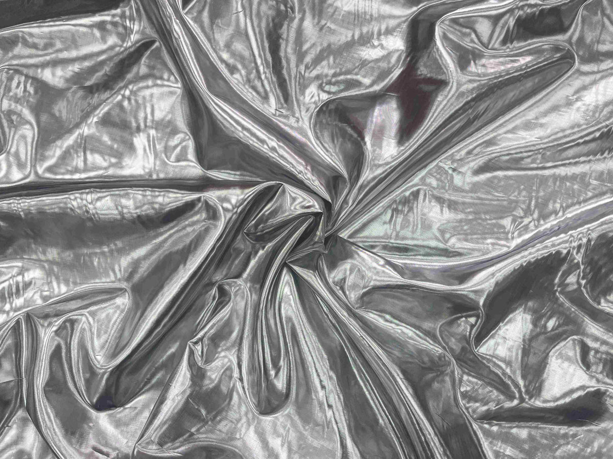 Black and silver metallic foil lame fabric from Cheap Fabrics, showcasing shiny, reflective surface and smooth texture.