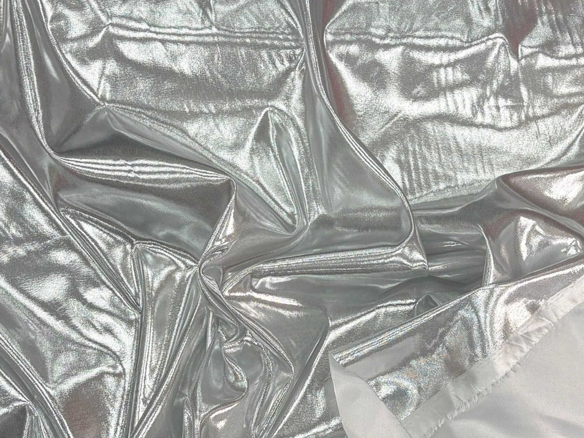 Shiny white metallic foil liquid satin fabric by Cheap Fabrics, showcasing smooth, reflective satin material with a glossy finish.