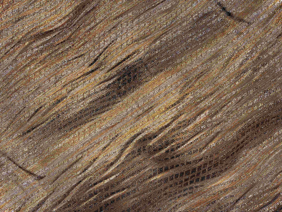 Copper metallic shimmer georgette fabric from Cheap Fabrics, showing smooth, shiny, lightweight georgette material with a shimmering finish.