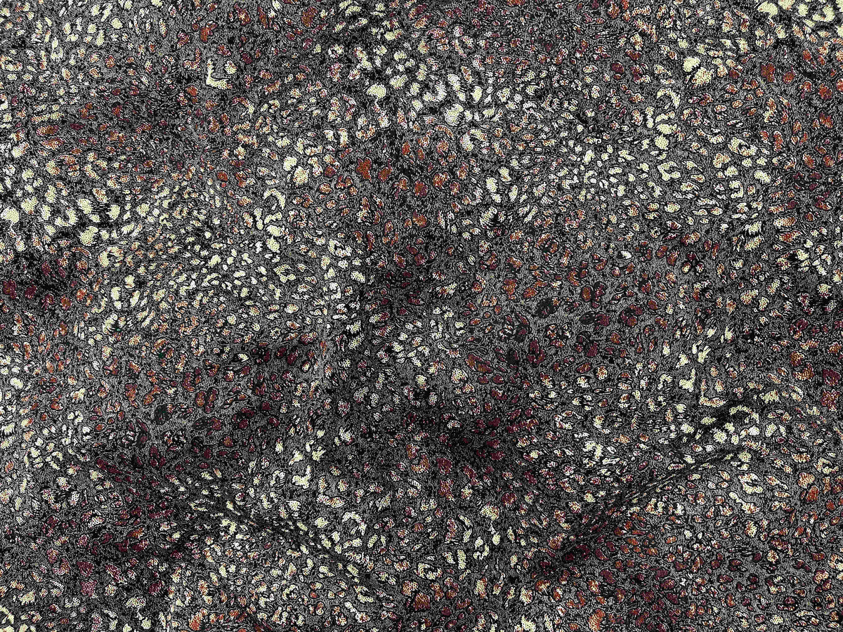 Soft brown and russet abstract animal print modal jersey fabric by Cheapfabrics, showcasing smooth, lightweight material ideal for apparel.