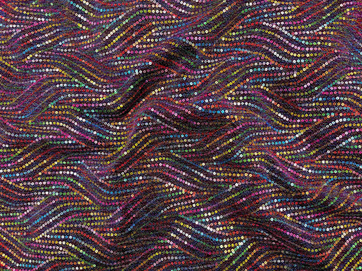Magenta multi sequin jersey knit fabric from Cheap Fabrics, showcasing shiny sequins on soft, stretchy jersey material.