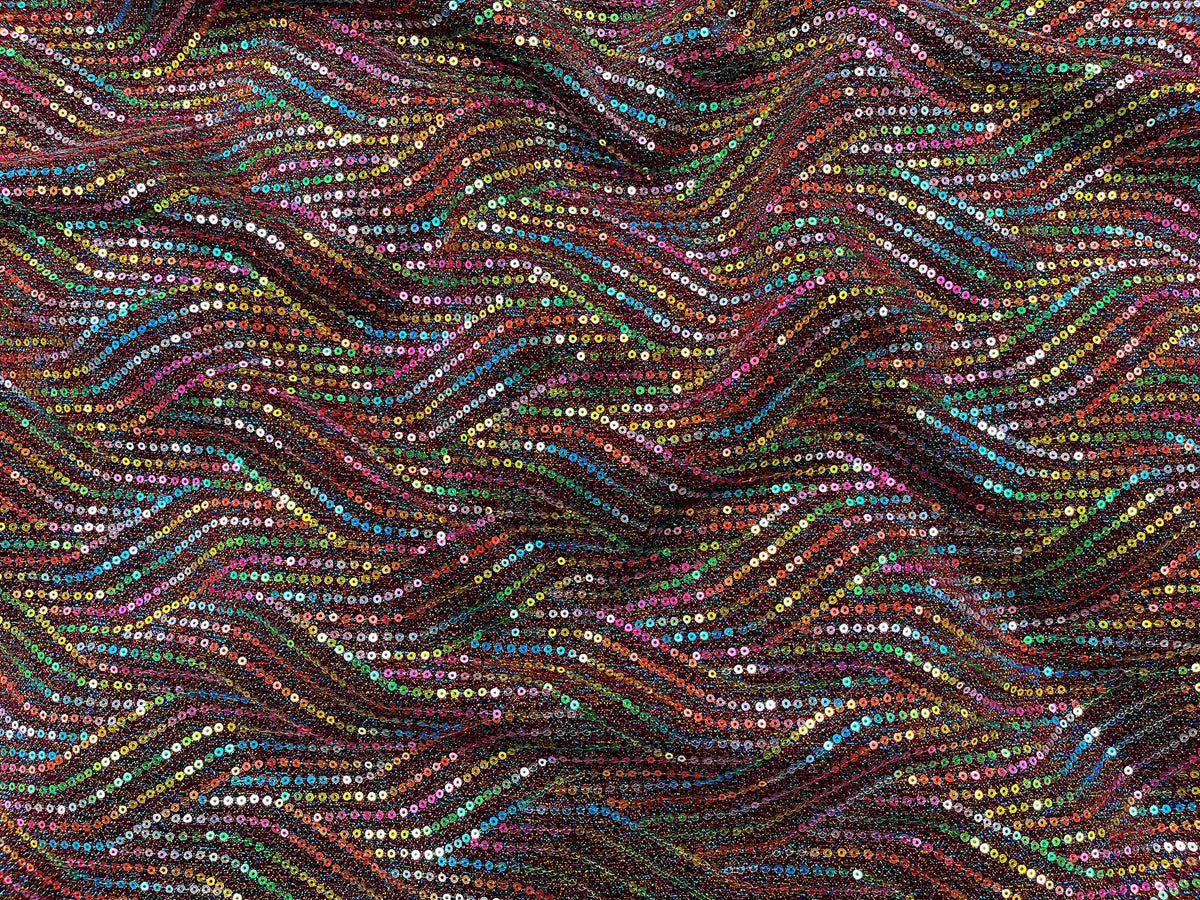 Maroon multi sequin jersey knit fabric by Cheap Fabrics, showing a close-up of shiny sequins and soft jersey texture.