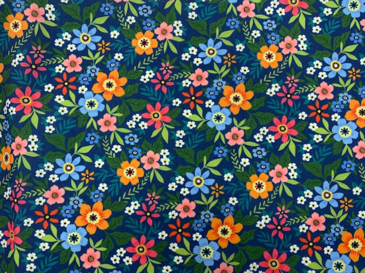 Navy and green large floral wildflower print on polycotton fabric by Cheap Fabrics, showcasing vibrant wildflower design.