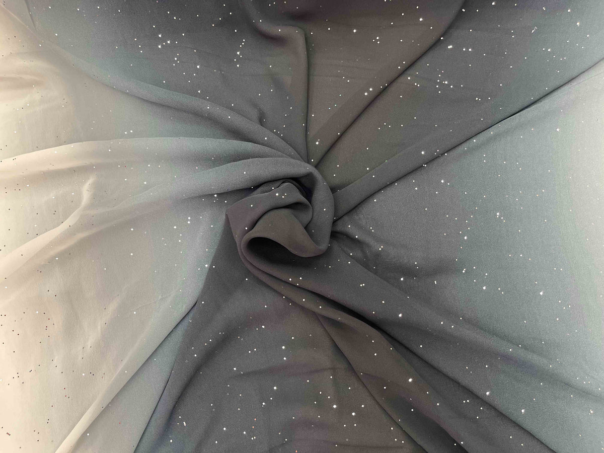 Black ombre crystal chiffon fabric from Cheap Fabrics, showcasing its flowing, lightweight chiffon material with shimmering crystal details.