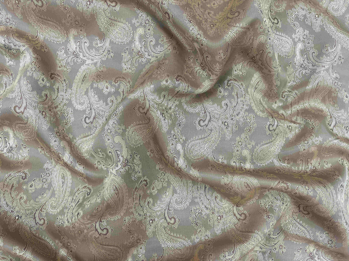 Self-embossed paisley jacquard fabric in antique gold with intricate pattern from Cheapfabrics.
