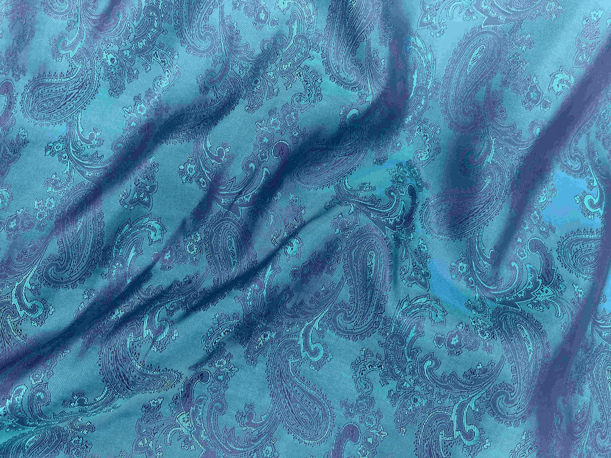 Self-embossed Paisley Jacquard fabric by Cheapfabrics in vibrant kingfisher blue, featuring intricate embossed paisley patterns.