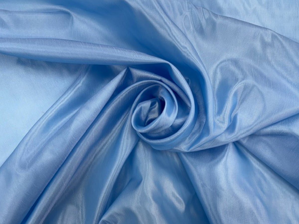 Pale blue taffeta fabric by Cheapfabrics, smooth and shiny taffeta material ideal for dresses and special occasion garments.