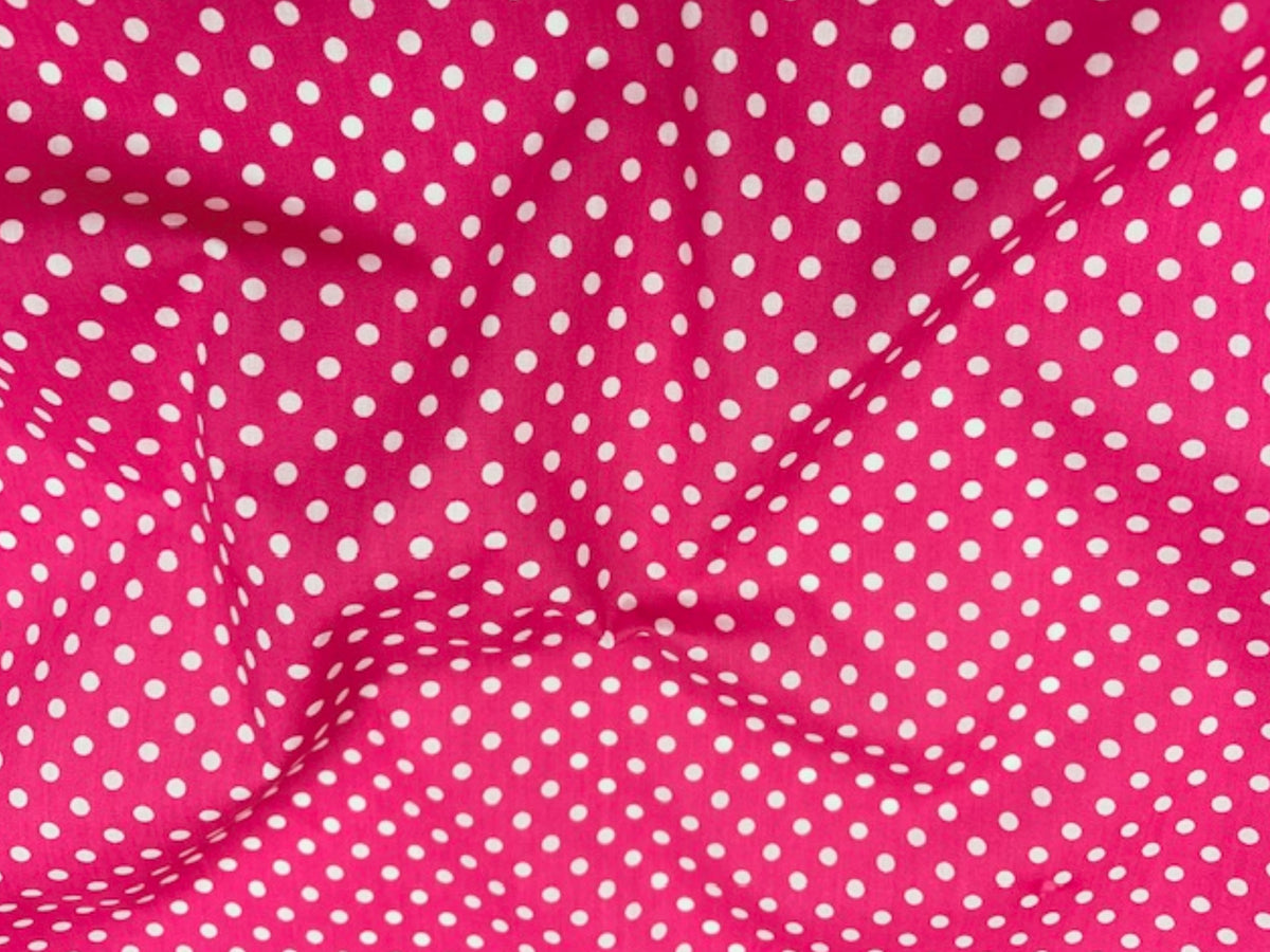 Polka Dots Poly/Cotton fabric by Cheap Fabrics featuring a classic black and white polka dot print.