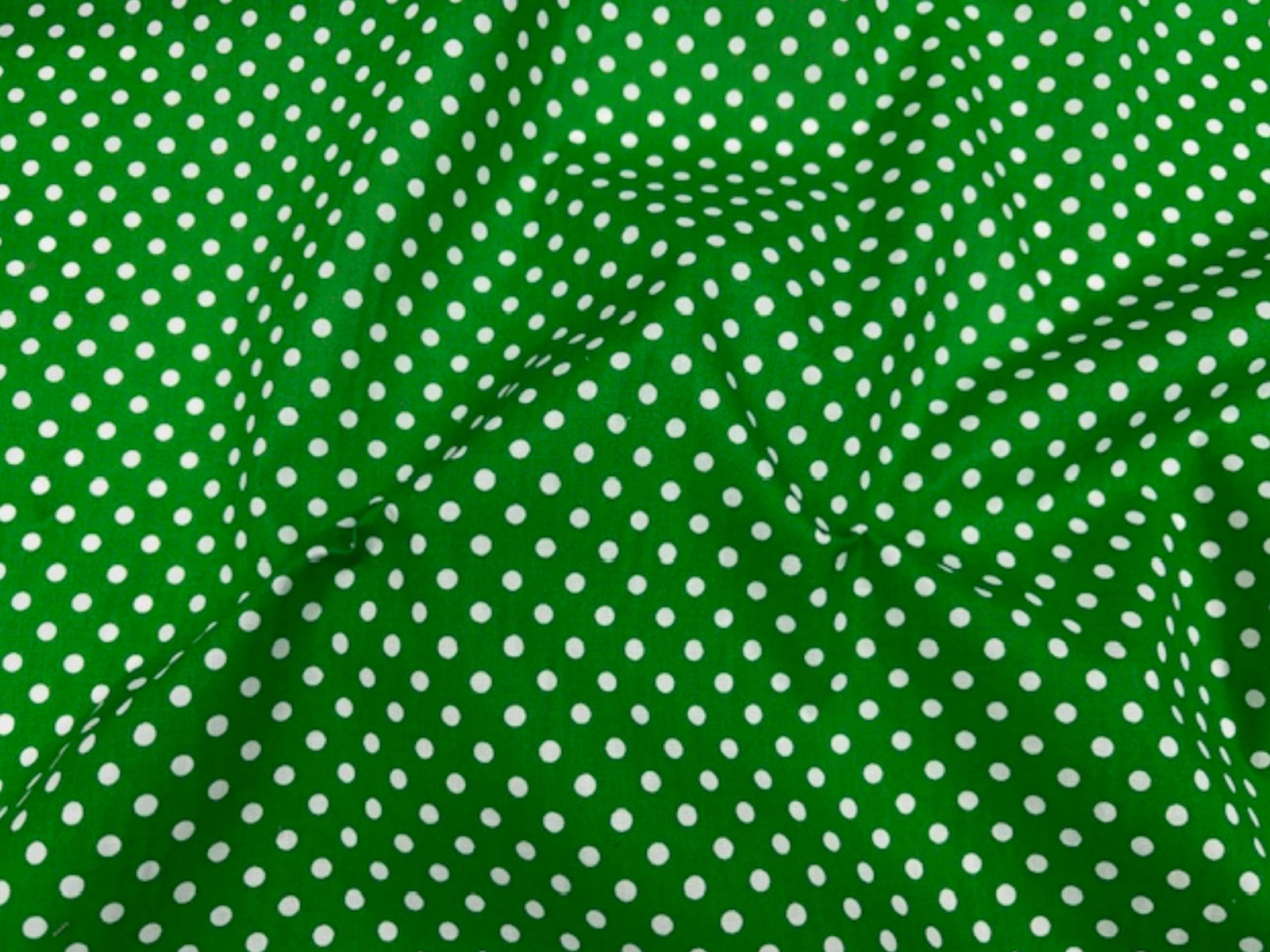 Polka Dots polycotton fabric by Cheap Fabrics with a playful black and white polka dot print on soft, lightweight material.